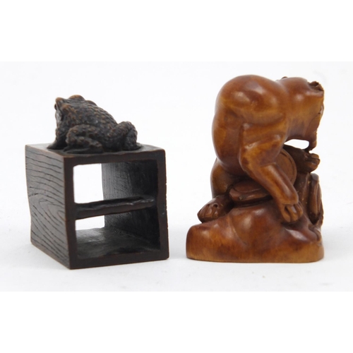 2966 - Chinese carved wood tiger and toad seated on a log, the largest 4.5cm high