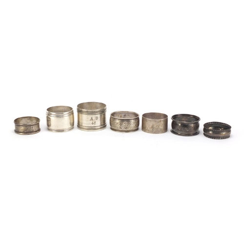 3007 - Seven silver and white metal napkin rings, various hallmarks, 152.4g