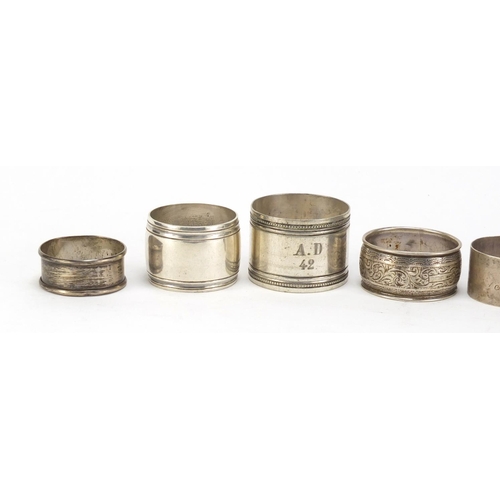 3007 - Seven silver and white metal napkin rings, various hallmarks, 152.4g