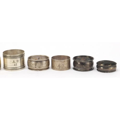 3007 - Seven silver and white metal napkin rings, various hallmarks, 152.4g