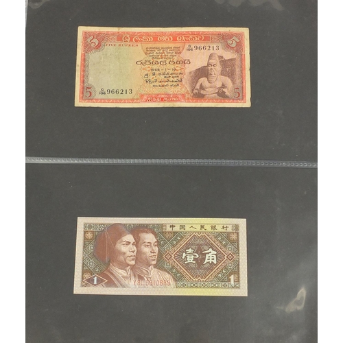 2698 - Album of world banknotes including China