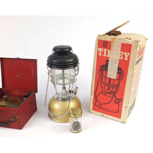 2433 - Four vintage lanterns and burners including a Tilley Stormlight and a vintage Pye radio