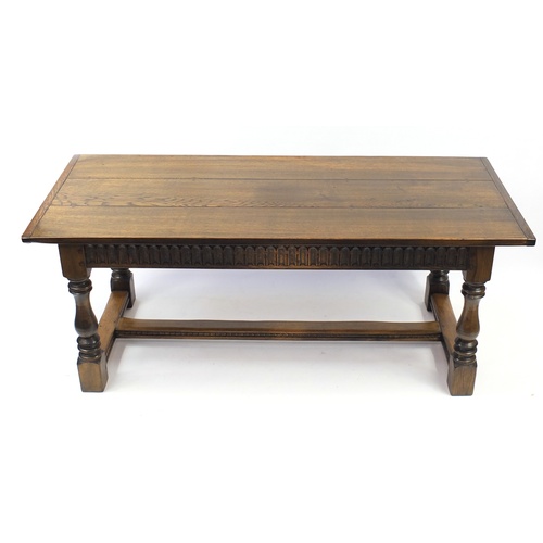 2076 - Oak refectory dining table, raised on four baluster turned legs united by an H stretcher, 76.5cm H x... 