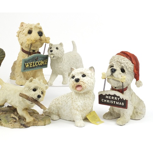 2474 - Seven Westie dog models including a stick stand, the largest 36.5cm high