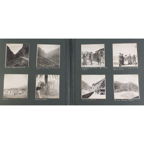 2687 - Early 20th century black and white photographs arranged in an album together with a 19th century boo... 