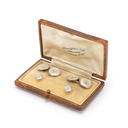 43 - 9ct gold and mother of pearl gentlemen's dress stud and cufflink set, housed in a Finnigans Ltd fitt... 