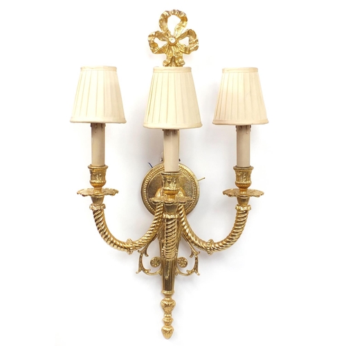 115 - Pair of Louis XVI style three branch brass wall sconces with shades, 67cm high