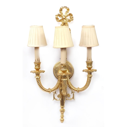 115 - Pair of Louis XVI style three branch brass wall sconces with shades, 67cm high