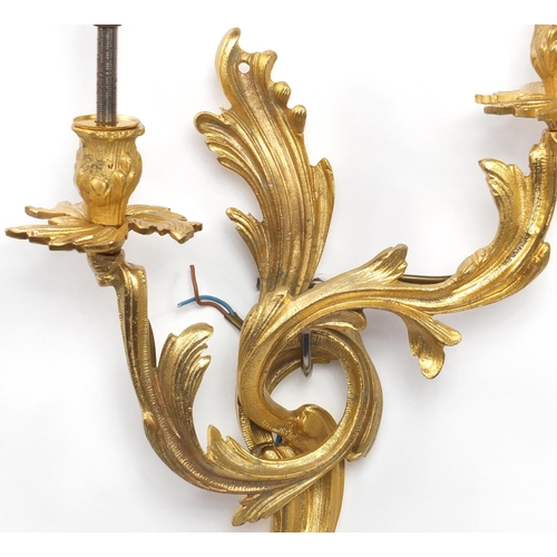 31 - Pair of Rococo style two branch brass wall sconces, 45cm high