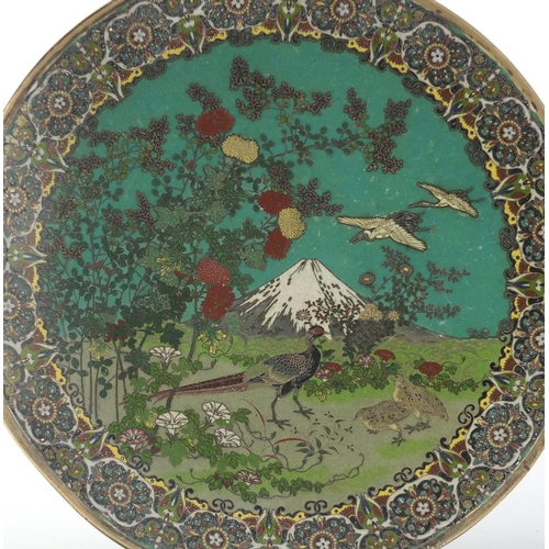 81 - Pair of Japanese Cloisonne plates with unmarked silver rims, each finely enamelled with storks, phea... 