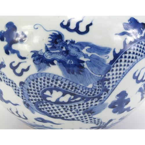 74 - Chinese blue and white porcelain jar, hand painted with two dragons amongst clouds within ruyi borde... 