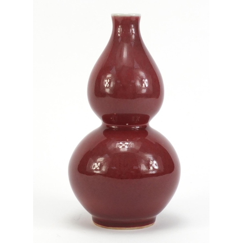 76 - Chinese porcelain sang de boeuf glazed vase of double gourd form, 21.5cm high