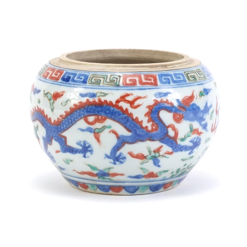 77 - Chinese porcelain wucai pot, hand painted with dragons amongst clouds chasing flaming pearl, six fig... 