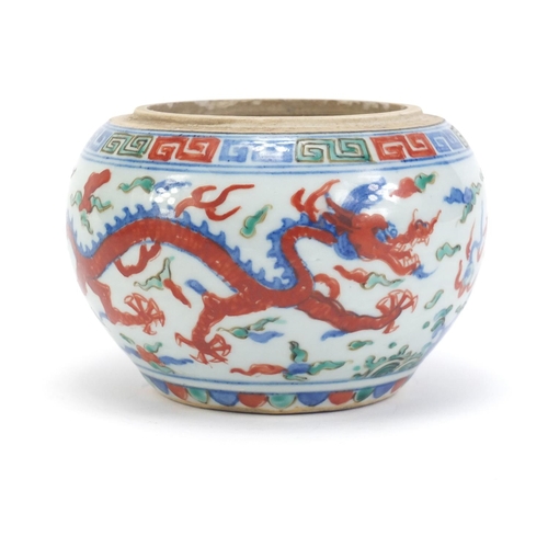 77 - Chinese porcelain wucai pot, hand painted with dragons amongst clouds chasing flaming pearl, six fig... 