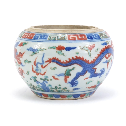 77 - Chinese porcelain wucai pot, hand painted with dragons amongst clouds chasing flaming pearl, six fig... 