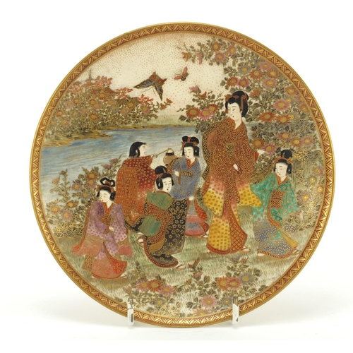 79 - Japanese Satsuma pottery plate, hand painted with figures in a landscape, character marks to the rev... 