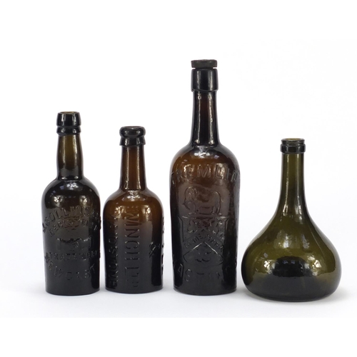 779 - Four antique glass bottles including Fremlin & Wynand Fockink the largest 26cm high