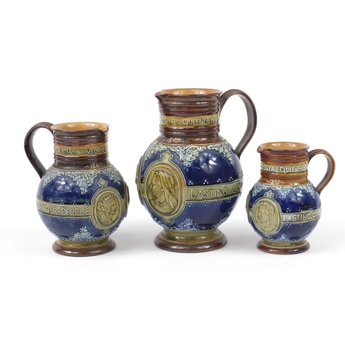 92 - Graduated set of three Doulton Lambeth Queen Victoria commemorative jugs, the largest 23.5cm high