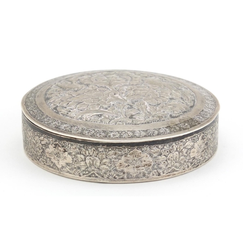 99 - Indian circular silver box and cover embossed with birds amongst foliage, impressed marks to the bas... 