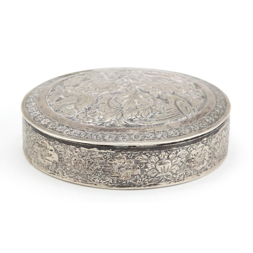 99 - Indian circular silver box and cover embossed with birds amongst foliage, impressed marks to the bas... 