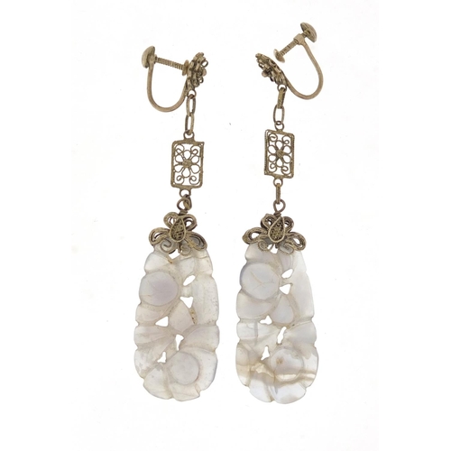 16 - Pair of Chinese white metal mounted agate earrings carved with flowers, 7.5cm in length, 9.8g