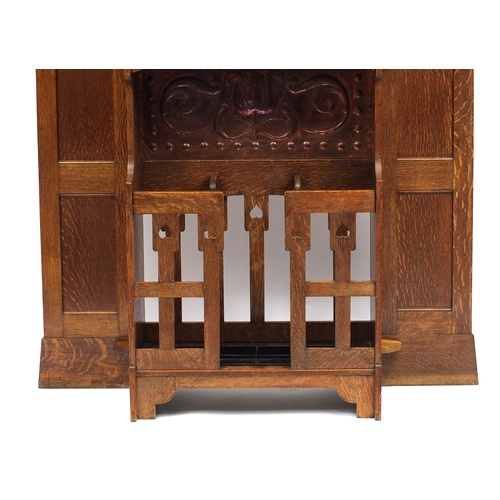 68 - Arts & Crafts oak hall stand with bevelled mirror and copper inserts to each wing, remnants of the o... 