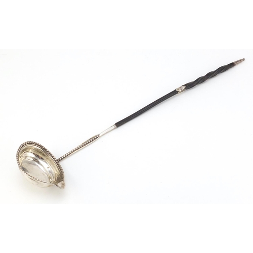 106 - Georgian unmarked silver ladle with twisted horn handle, 40cm in length