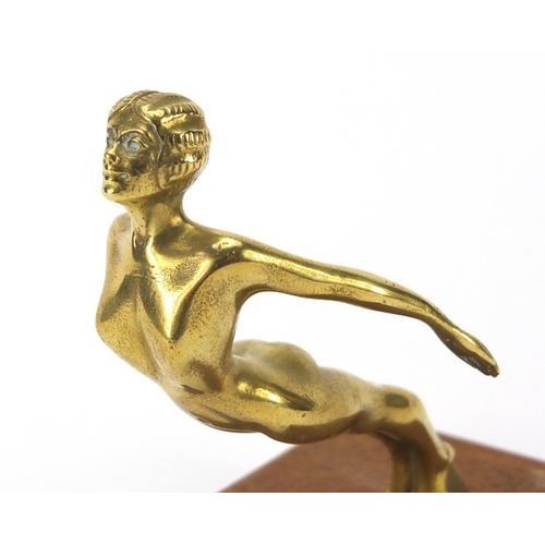 766 - Art Deco car mascot of a nude female by Desmo, raised on a wood block base, the mascot 11cm high