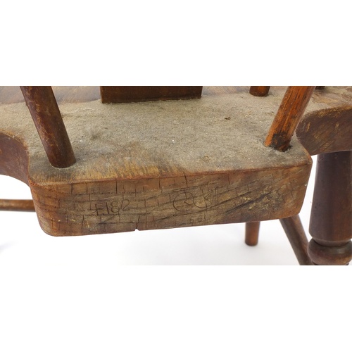 111 - Pair of antique wheel back elbow chairs with elm seats, 98cm high