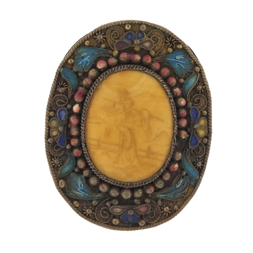15 - Chinese ivory and enamel brooch, the ivory panel carved with a Geisha girl, 4cm in length, 10.4g
