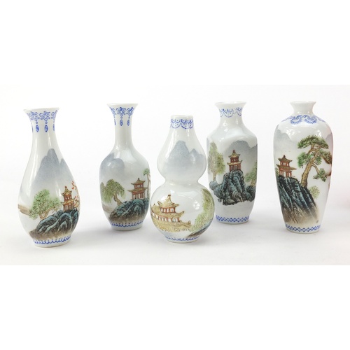 1272 - Set of five miniature Chinese porcelain vases, each hand painted with pagodas, housed in a fitted bo... 