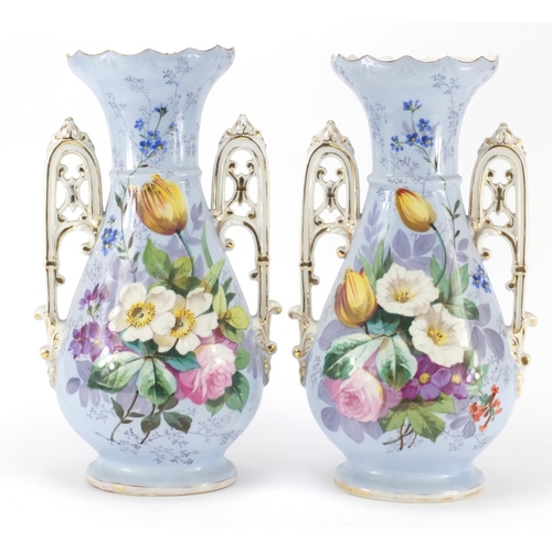 3910 - Pair of 19th century continental porcelain vases with twin handles, each hand painted with flowers o... 