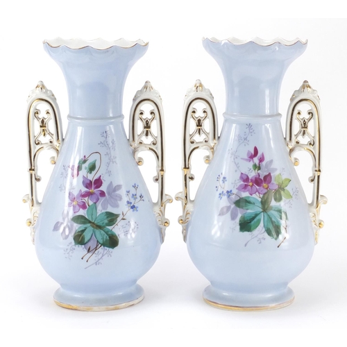 3910 - Pair of 19th century continental porcelain vases with twin handles, each hand painted with flowers o... 