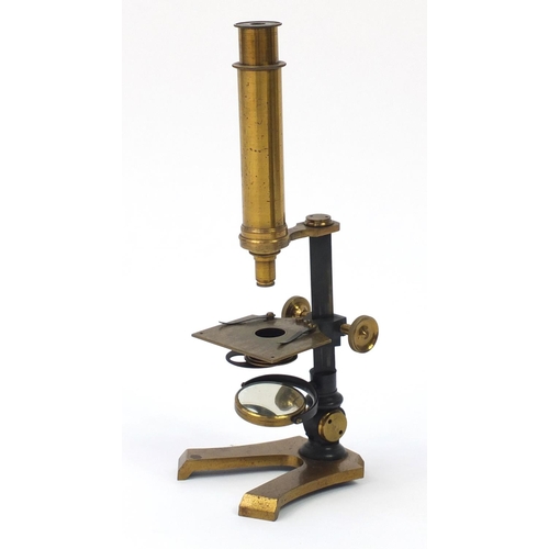 3179 - Victorian brass microscope and a small selection of student specimen glass slides, housed in a pine ... 