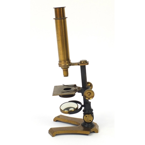 3179 - Victorian brass microscope and a small selection of student specimen glass slides, housed in a pine ... 