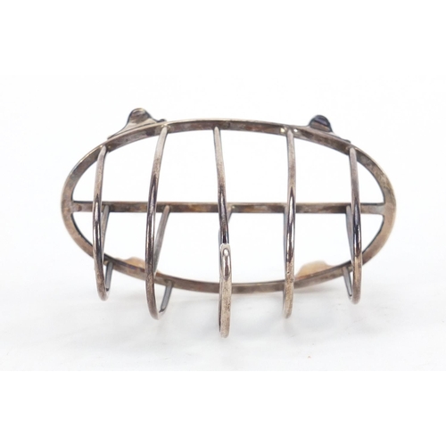 3935 - George V silver four slice toast rack by William Comyns & Sons, London 1914, 10cm wide, 68.3g