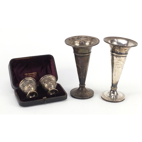 3821 - Two silver bud vases and a pair of Turkish silver egg cups, housed in a Hamilton & Inches box, the l... 