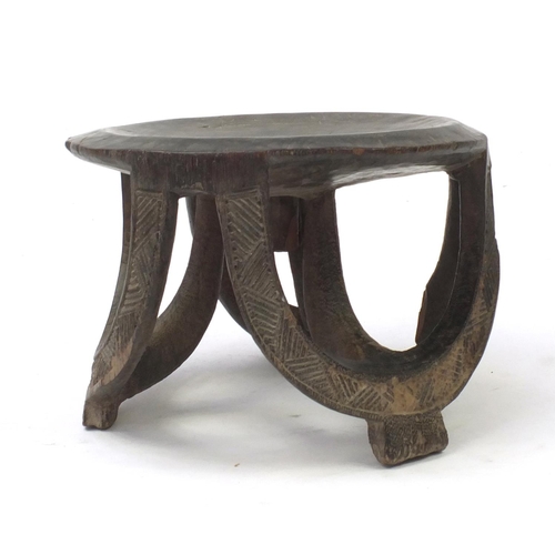 4263 - Tribal interest carved hardwood stool, 26.5cm high x 34cm in diameter