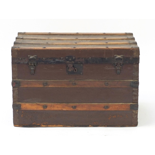 3512 - Vintage wooden bound travelling trunk with carrying handles, Whites Store label to the interior, 45.... 