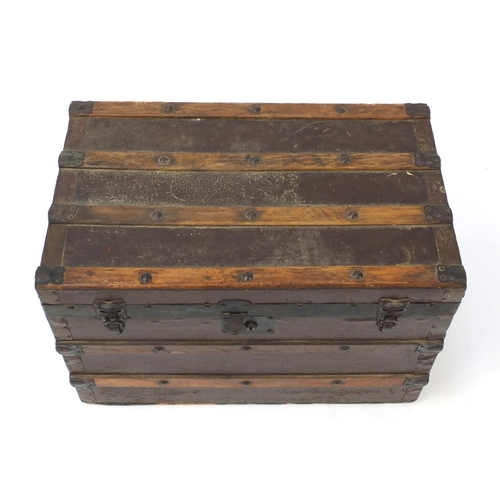 3512 - Vintage wooden bound travelling trunk with carrying handles, Whites Store label to the interior, 45.... 