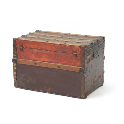 3512 - Vintage wooden bound travelling trunk with carrying handles, Whites Store label to the interior, 45.... 