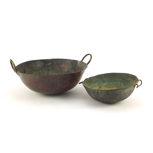 3841 - Two heavy Middle Eastern cooking bowls including a bronze example, the largest 34cm in diameter