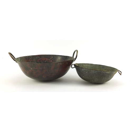 3841 - Two heavy Middle Eastern cooking bowls including a bronze example, the largest 34cm in diameter