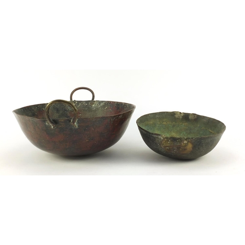 3841 - Two heavy Middle Eastern cooking bowls including a bronze example, the largest 34cm in diameter