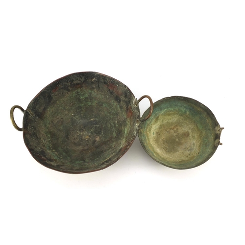 3841 - Two heavy Middle Eastern cooking bowls including a bronze example, the largest 34cm in diameter