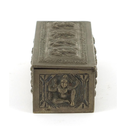 3137 - Burmese unmarked silver box with hinged lid, embossed with deities, 10cm wide, 100.9g