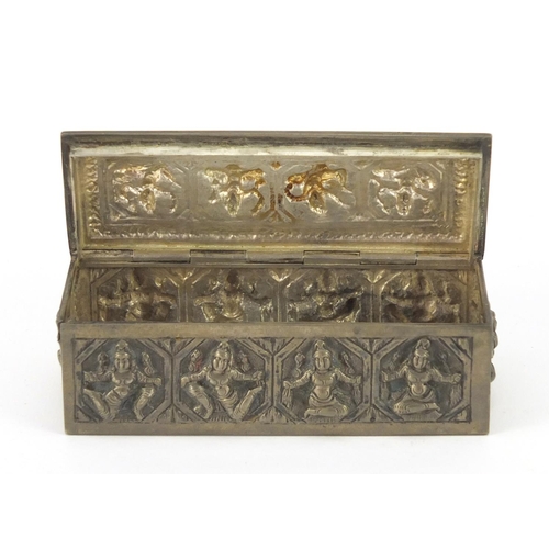 3137 - Burmese unmarked silver box with hinged lid, embossed with deities, 10cm wide, 100.9g