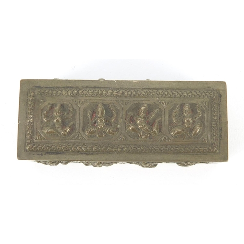 3137 - Burmese unmarked silver box with hinged lid, embossed with deities, 10cm wide, 100.9g