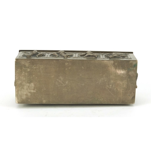 3137 - Burmese unmarked silver box with hinged lid, embossed with deities, 10cm wide, 100.9g