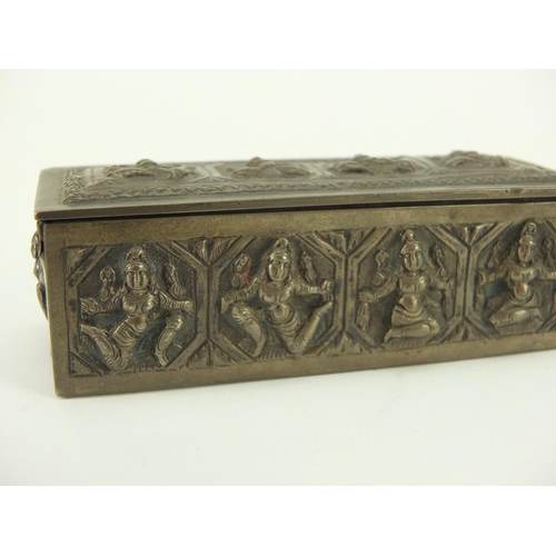 3137 - Burmese unmarked silver box with hinged lid, embossed with deities, 10cm wide, 100.9g